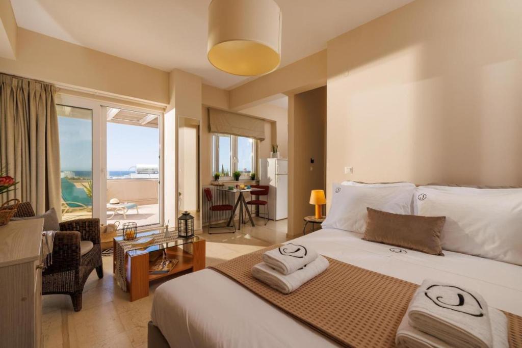 Postel nebo postele na pokoji v ubytování Jolly Suites