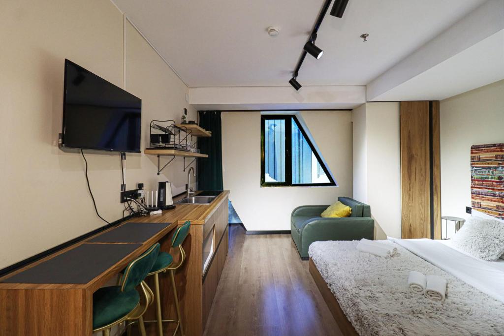 TV a/nebo společenská místnost v ubytování Apartment in Marshall Gudauri Project