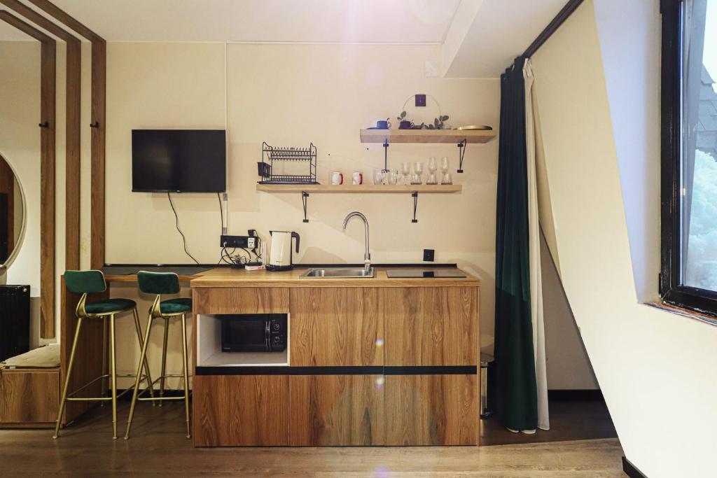 Kuchyň nebo kuchyňský kout v ubytování Apartment in Marshall Gudauri Project