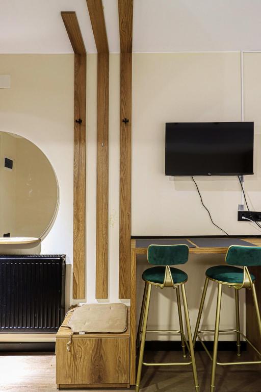 TV a/nebo společenská místnost v ubytování Apartment in Marshall Gudauri Project