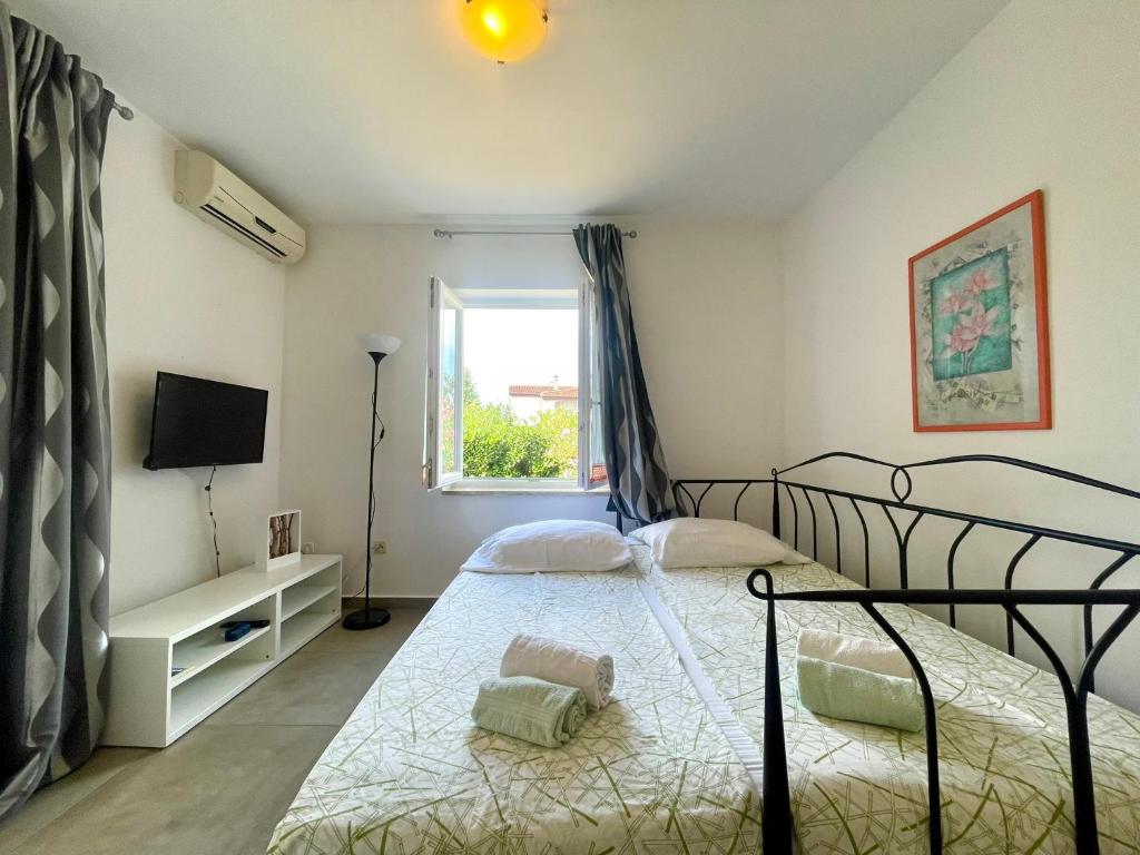 Postel nebo postele na pokoji v ubytování Apartments G&G