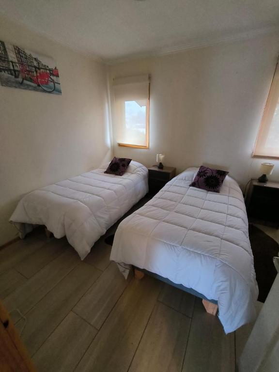 Postel nebo postele na pokoji v ubytování APART HOTEL EN BULNES