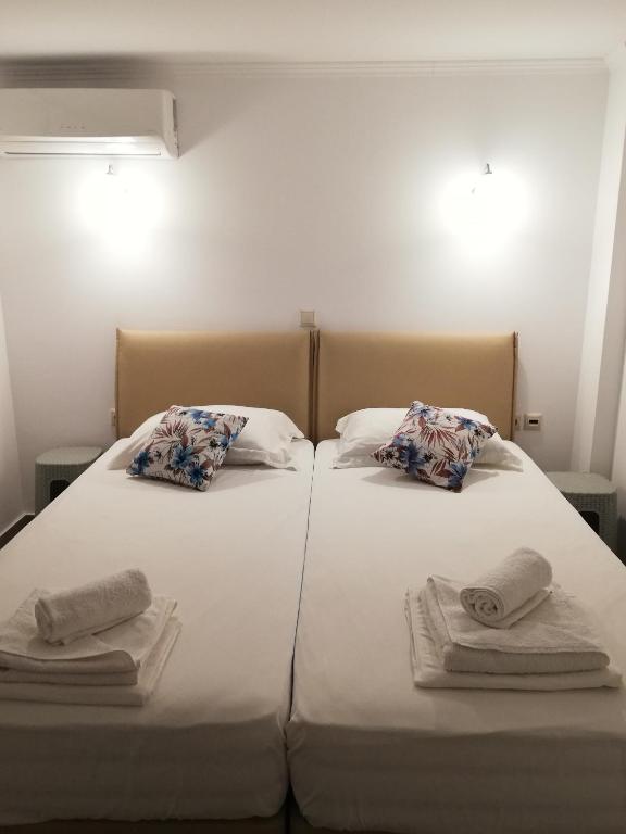 Postel nebo postele na pokoji v ubytování Andromeda Seaside Apartments