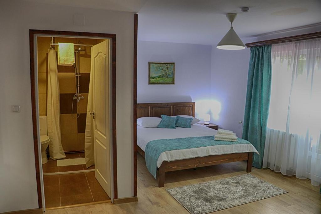 Postel nebo postele na pokoji v ubytování Casa Camelia