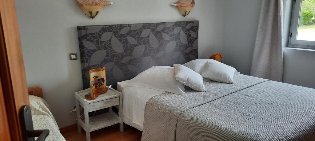 Postel nebo postele na pokoji v ubytování Chambres d'hôtes Chez Dumitra