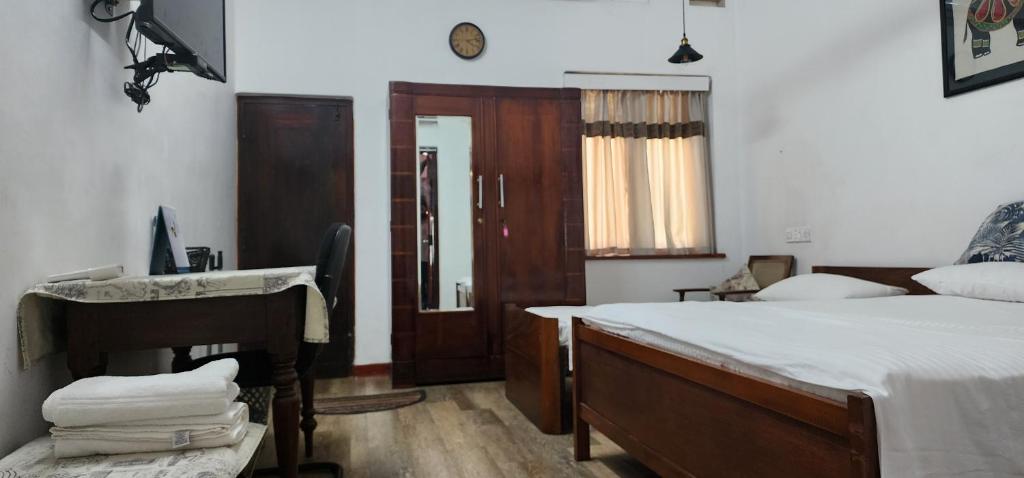Postel nebo postele na pokoji v ubytování CHARAKAMA Guest Bungalow - GAMPAHA