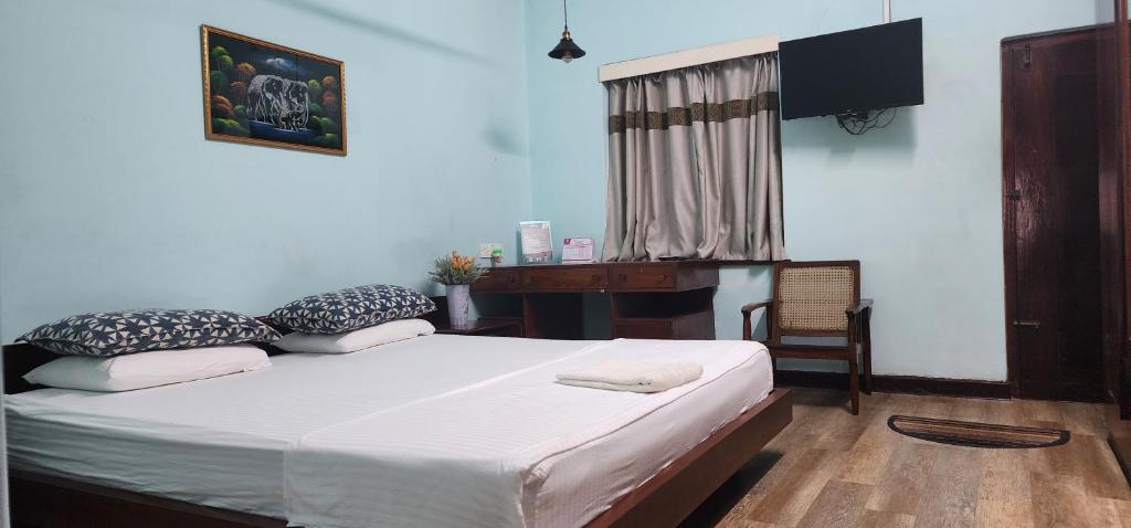 Postel nebo postele na pokoji v ubytování CHARAKAMA Guest Bungalow - GAMPAHA