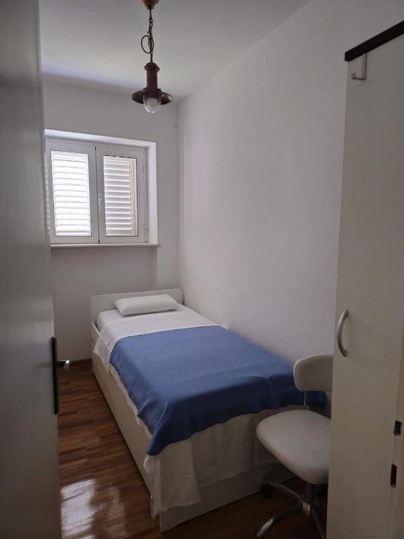 Postel nebo postele na pokoji v ubytování Two bedroom Apartment Libertas