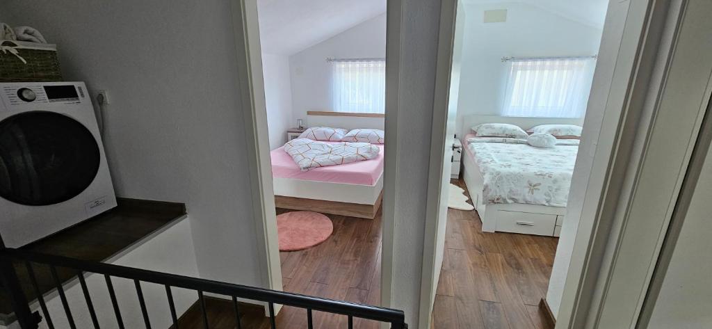 Postel nebo postele na pokoji v ubytování Melek