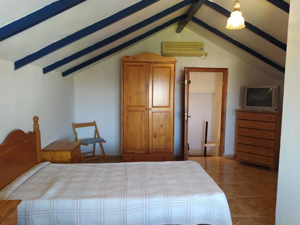 Ένα ή περισσότερα κρεβάτια σε δωμάτιο στο Pensión El Chalet