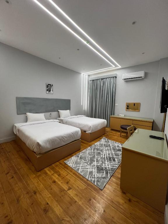 Postel nebo postele na pokoji v ubytování Zamalek House Hotel