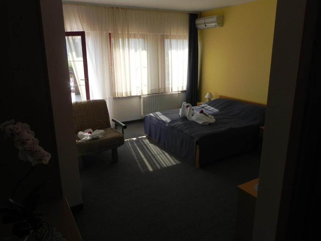 Postel nebo postele na pokoji v ubytování Motel Majolka
