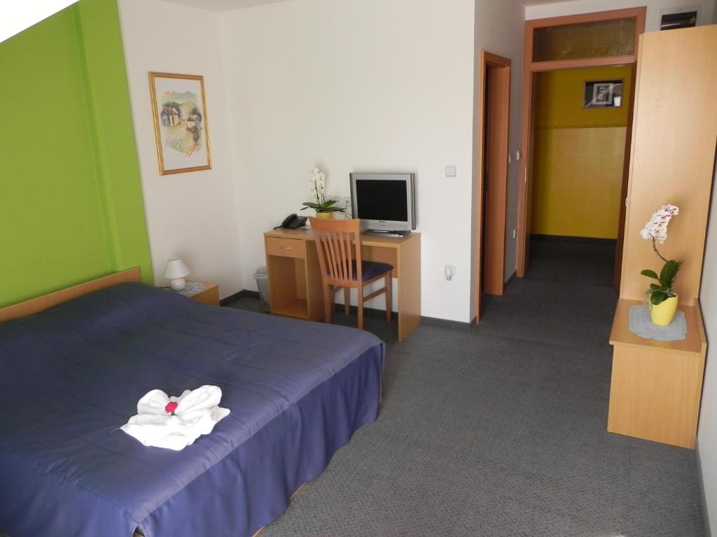 Postel nebo postele na pokoji v ubytování Motel Majolka