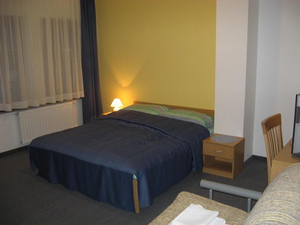 Postel nebo postele na pokoji v ubytování Motel Majolka