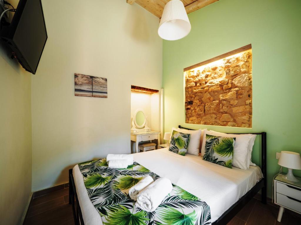 Postel nebo postele na pokoji v ubytování Sole Apartments - near Corfu Port