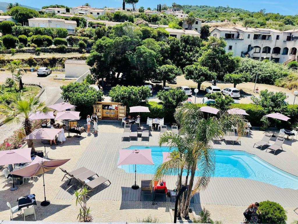 an aerial view of a resort with a swimming pool at Hotel l'Isolella in Porticcio