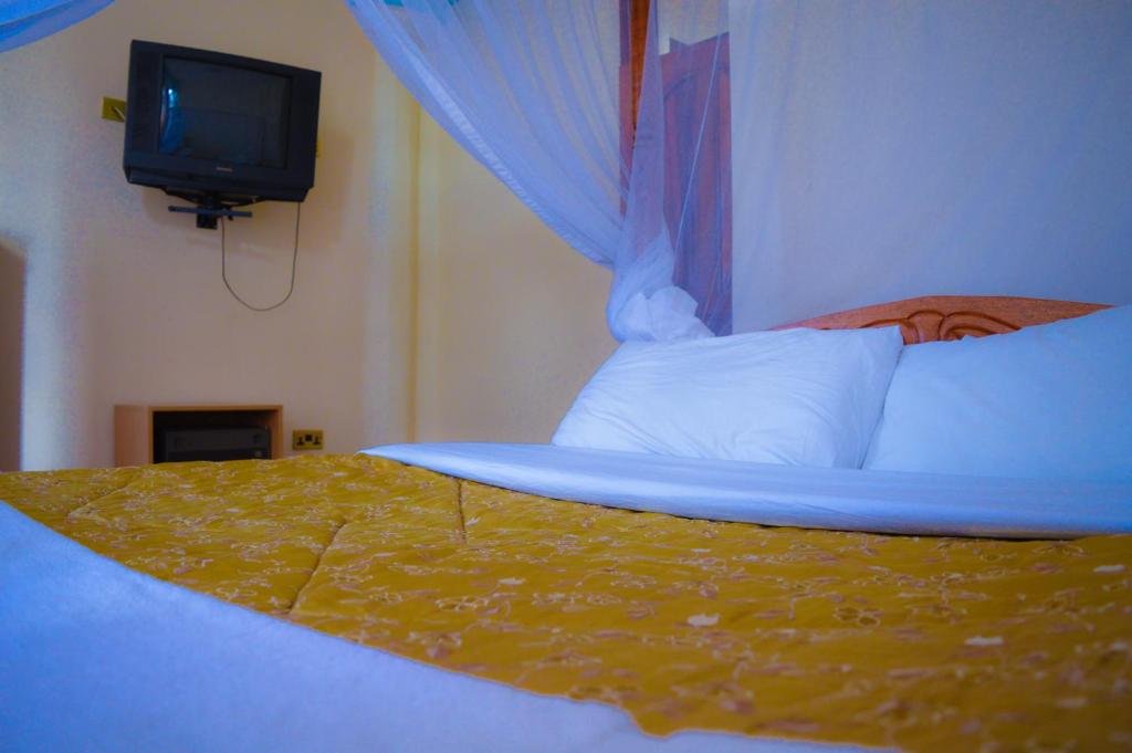 Postel nebo postele na pokoji v ubytování Stardom Hotel