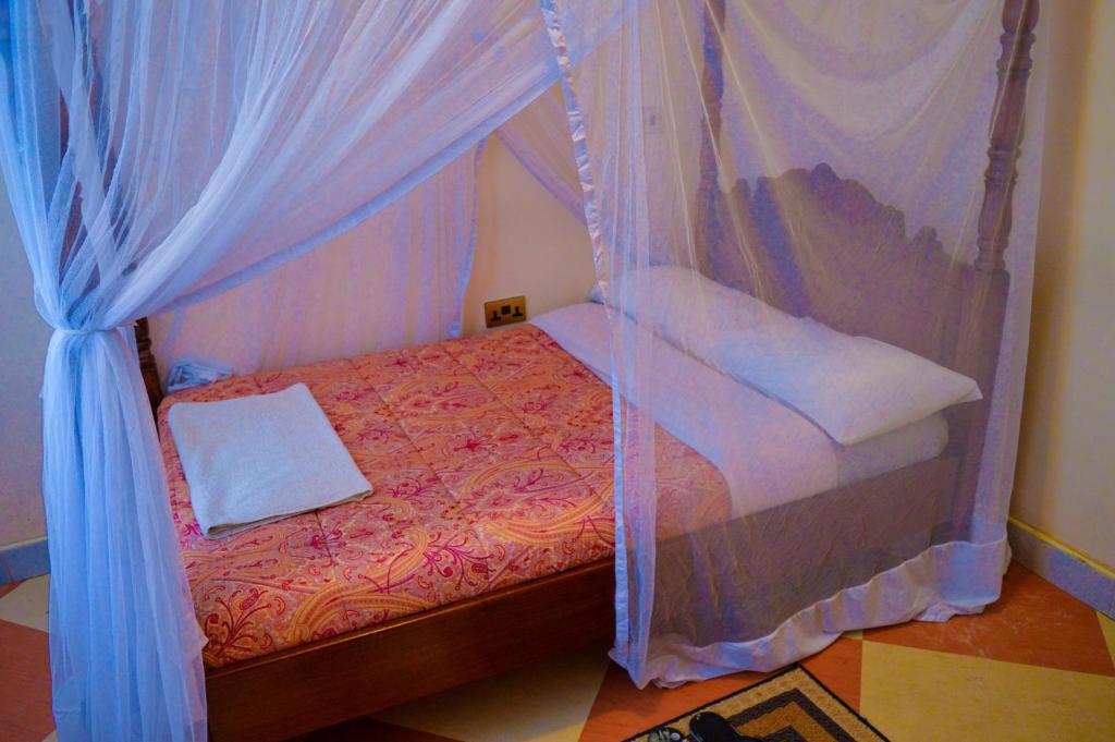 Postel nebo postele na pokoji v ubytování Stardom Hotel