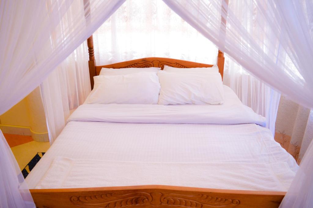 Postel nebo postele na pokoji v ubytování Stardom Hotel