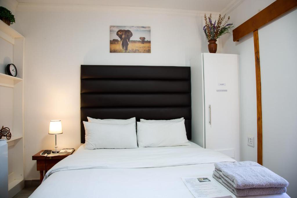 Letto o letti in una camera di The Affectionate One