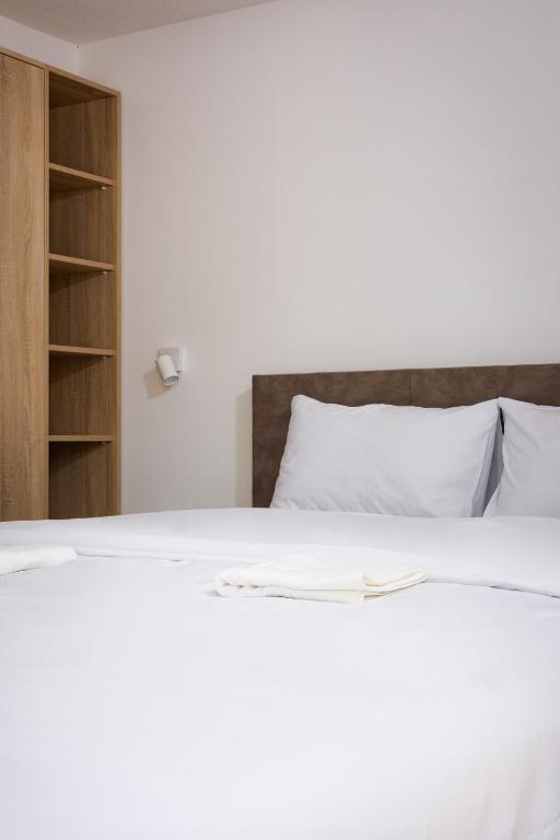 Postel nebo postele na pokoji v ubytování Restoran & Motel Manjež