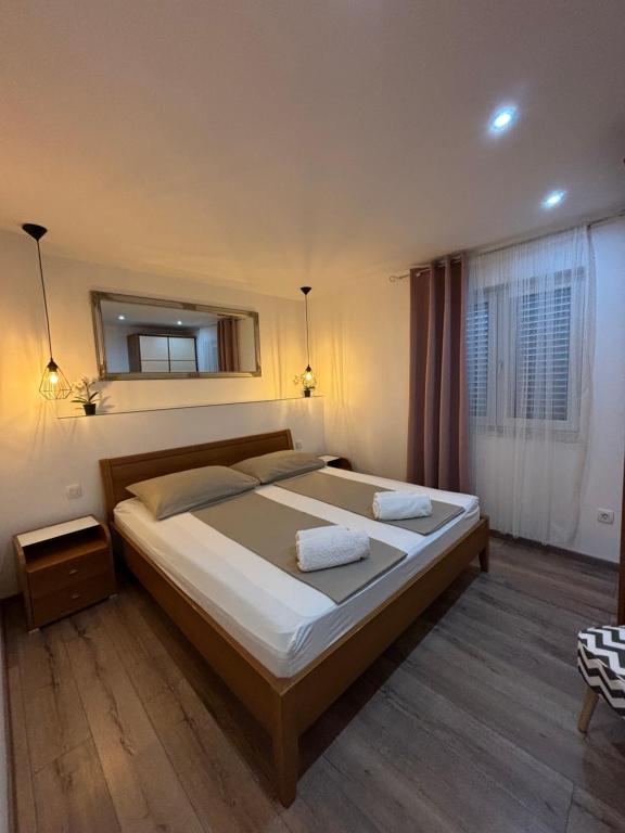 Posteľ alebo postele v izbe v ubytovaní Apartments ONE PALM