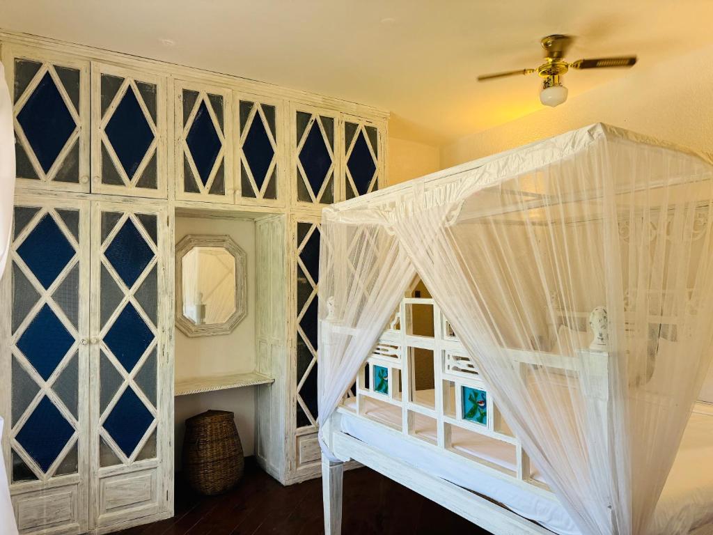 Postel nebo postele na pokoji v ubytování Watamu Villaggio