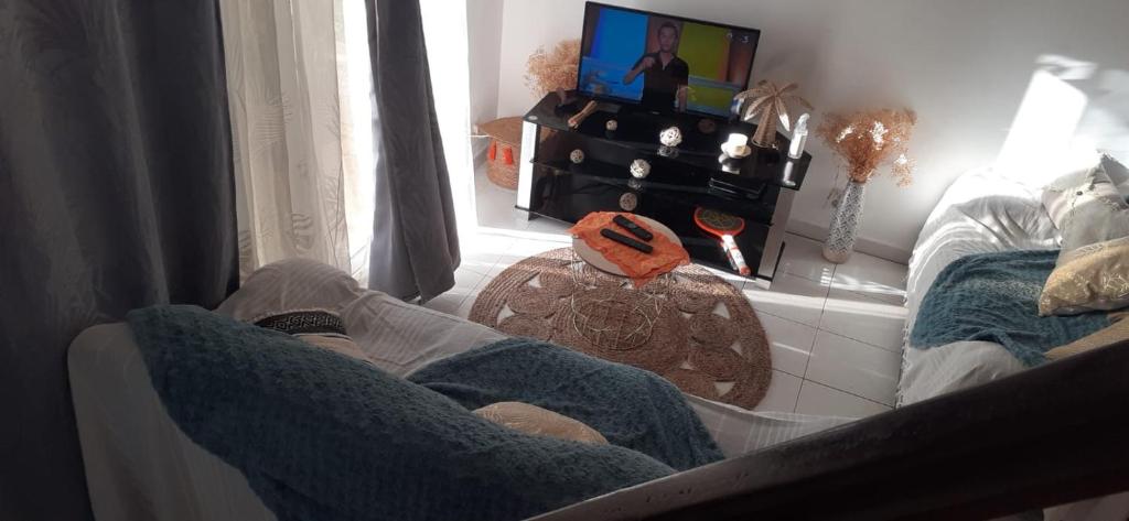 TV a/nebo společenská místnost v ubytování Sunbeachparadise