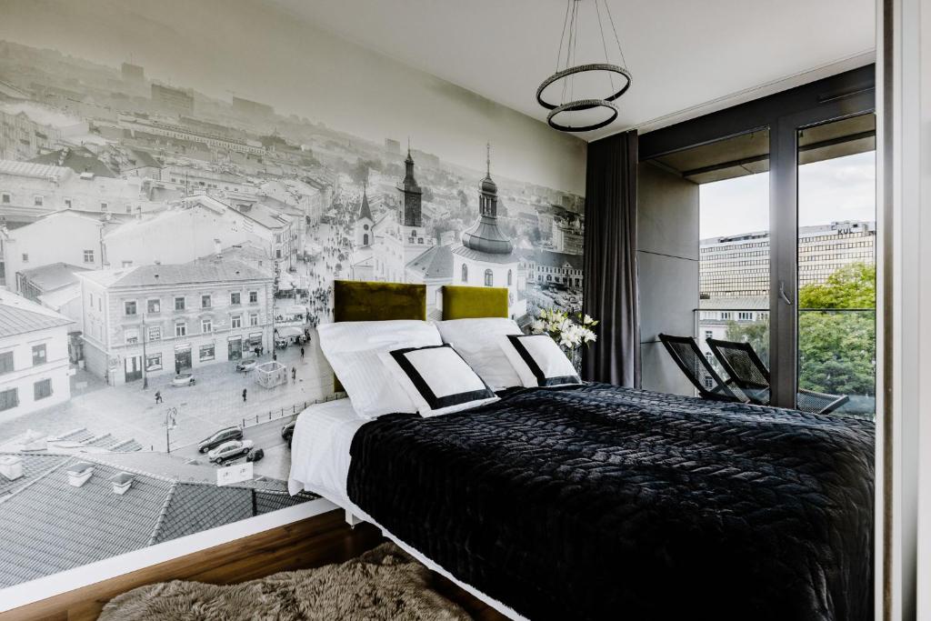 a bedroom with a wall mural of a city at APARTAMENTY ARTE LUBLIN Unia Art Residence 121- faktura VAT garaż in Lublin