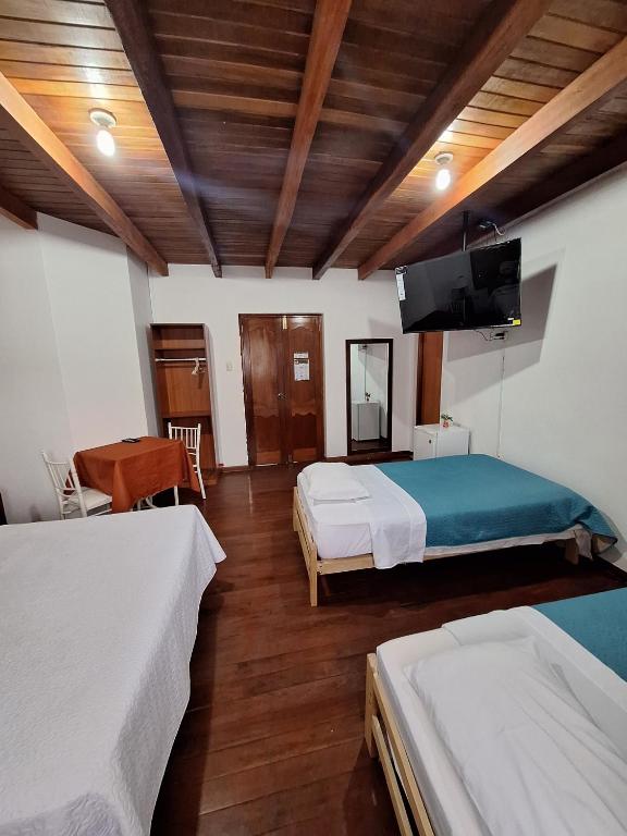 Postel nebo postele na pokoji v ubytování Casa Wayra Cajamarca