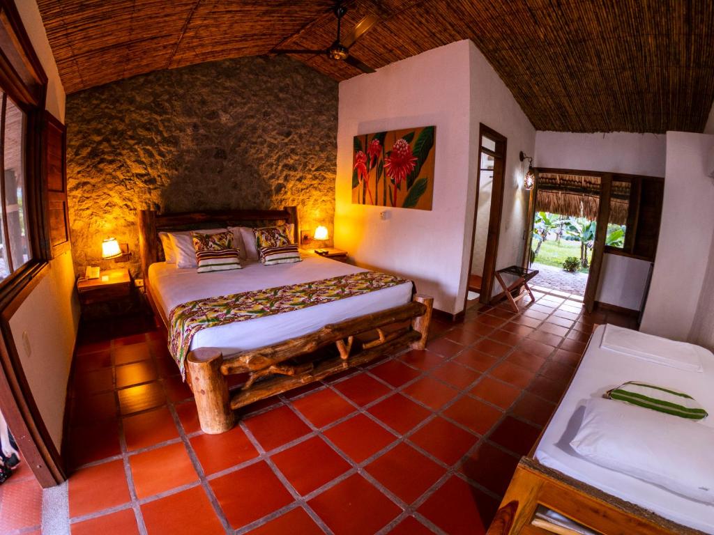 Postel nebo postele na pokoji v ubytování Hotel Brisas La Gaviota Mariquit-Tolima