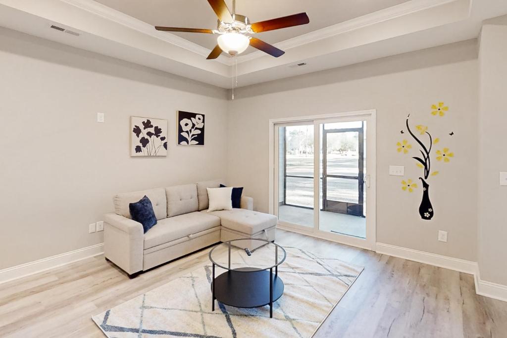 a living room with a couch and a ceiling fan at Old Bryan Salento - B in Myrtle Beach