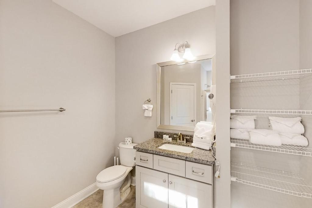 a white bathroom with a toilet and a sink at Old Bryan Salento - B in Myrtle Beach