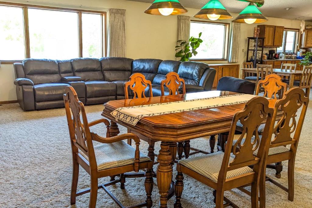 a living room with a wooden table and chairs at A Helena Haven in Helena
