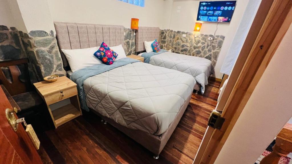 Postel nebo postele na pokoji v ubytování intikilla hostal
