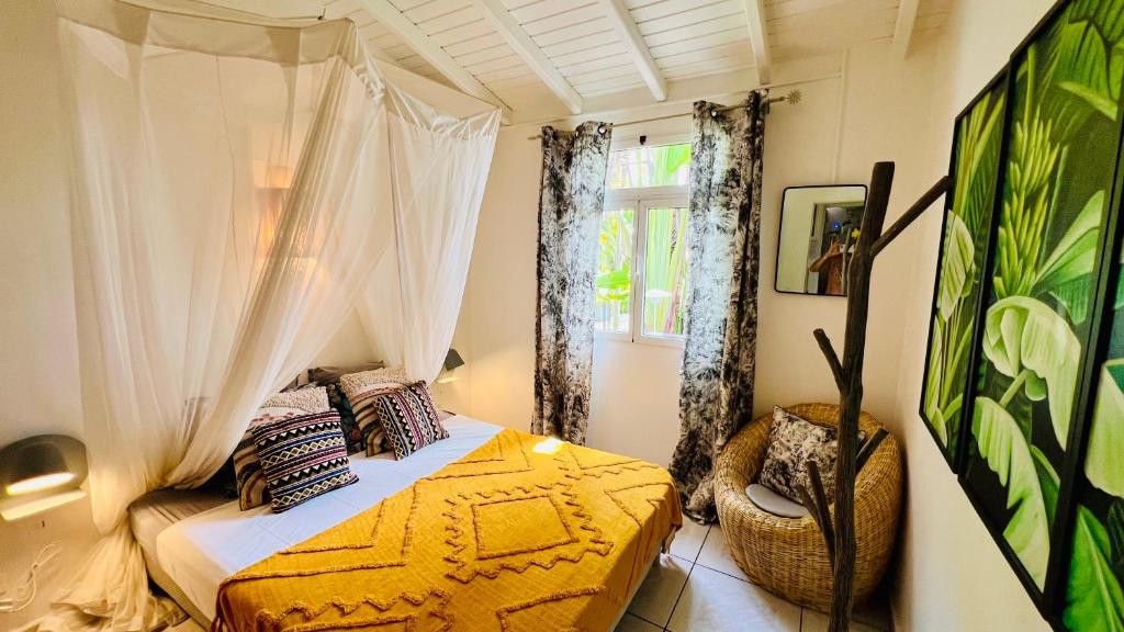 Postel nebo postele na pokoji v ubytování Île tropical lodges