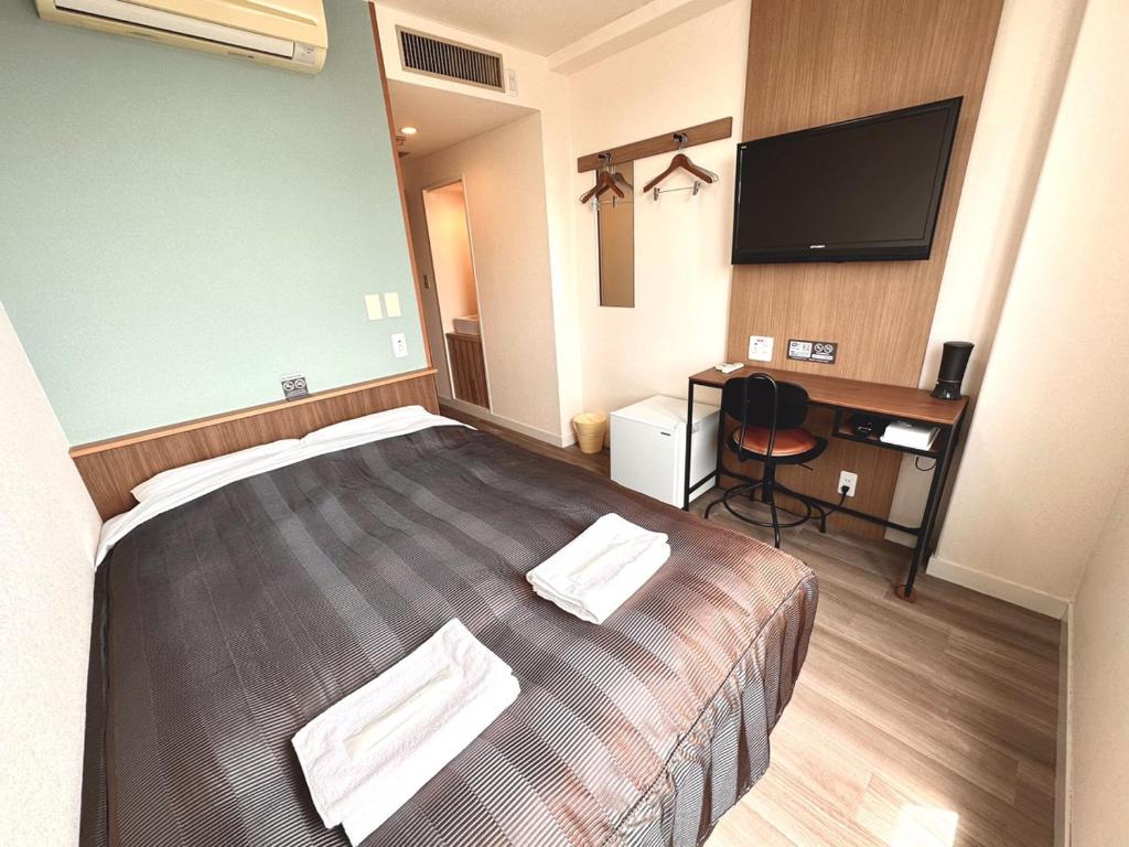 Postel nebo postele na pokoji v ubytování Tabist Tsukuba Sky Hotel