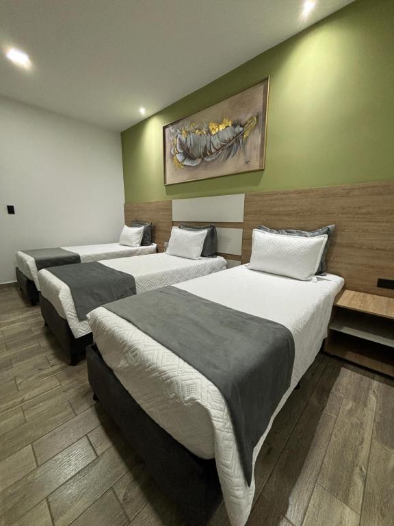 Postel nebo postele na pokoji v ubytování M A Hotel