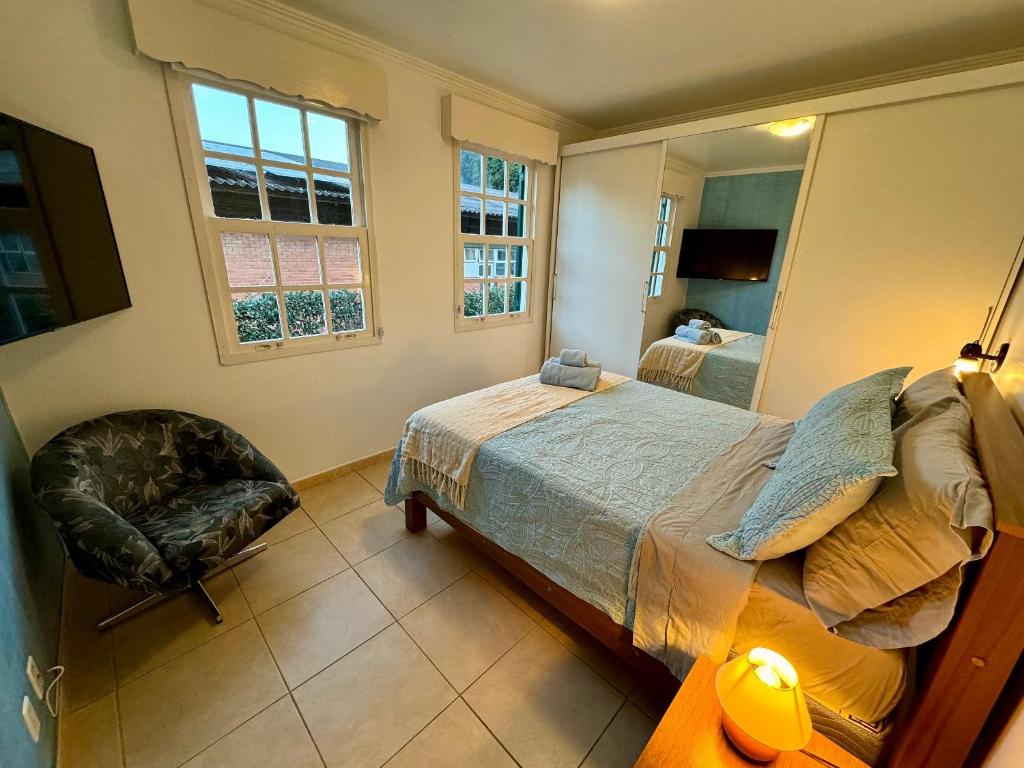 Ένα ή περισσότερα κρεβάτια σε δωμάτιο στο Apartamento com piscina em Olaria