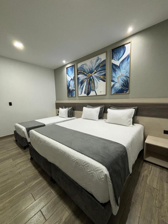 Postel nebo postele na pokoji v ubytování M A Hotel