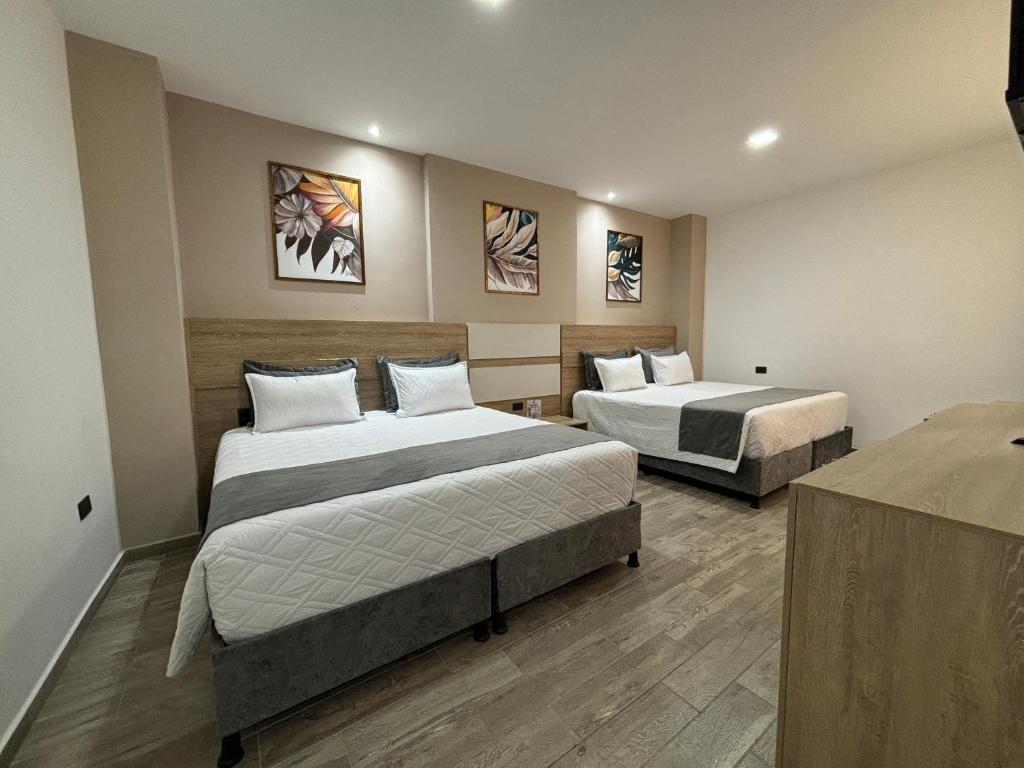 Postel nebo postele na pokoji v ubytování M A Hotel