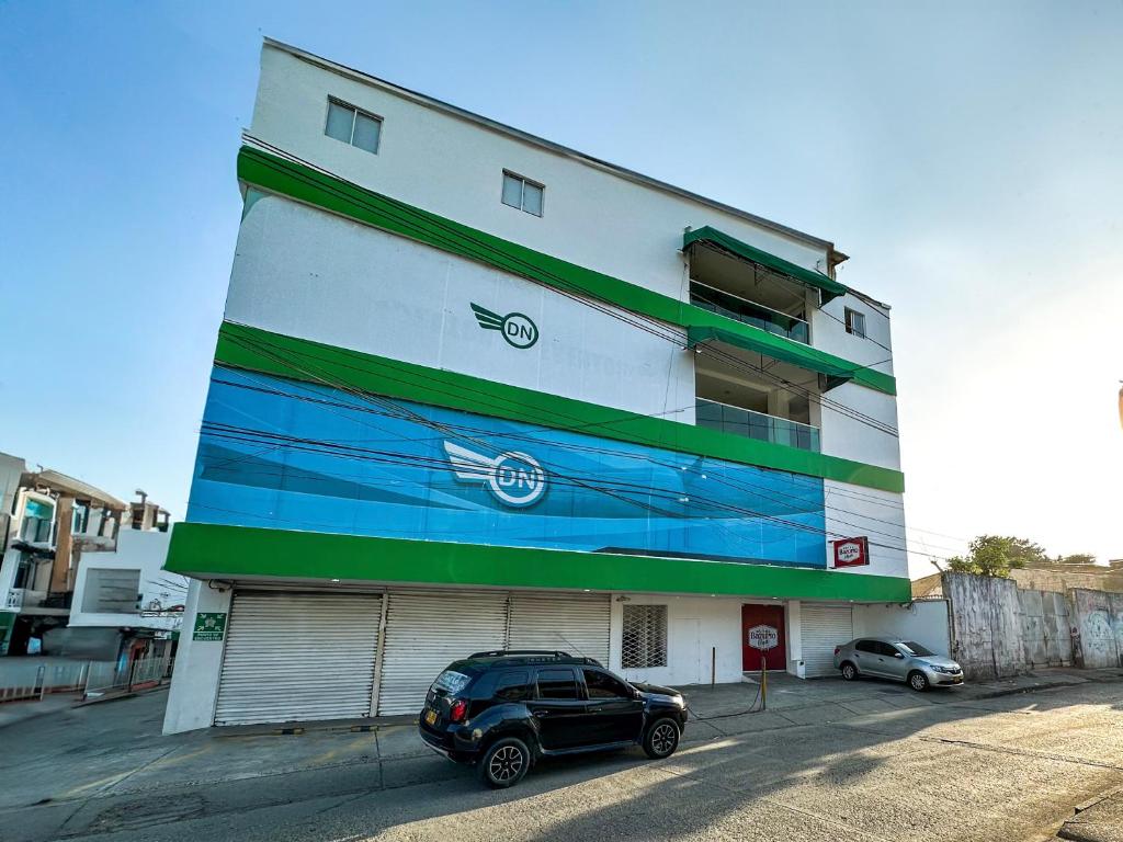 a car parked in front of a building at Hotel bazurto plaza in Cartagena de Indias