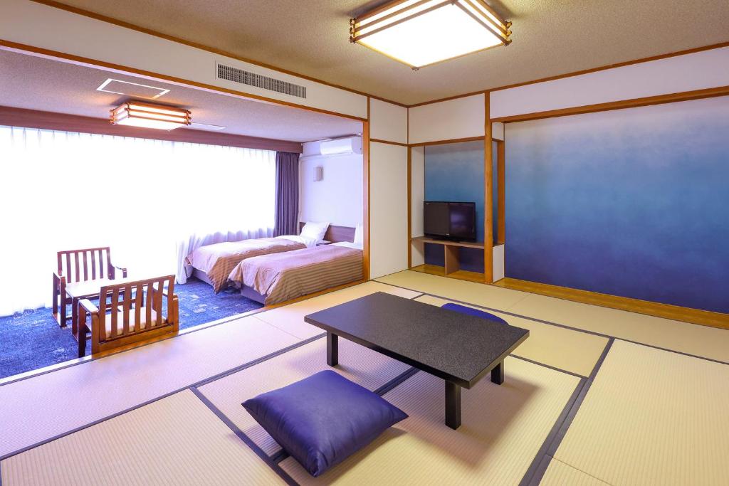 Postel nebo postele na pokoji v ubytování Ooedo Onsen Monogatari Premium Kinugawa Kanko Hotel