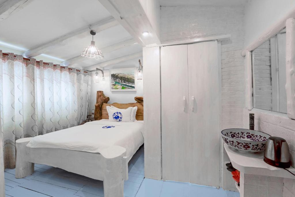 Postel nebo postele na pokoji v ubytování Zhoujia Hostel