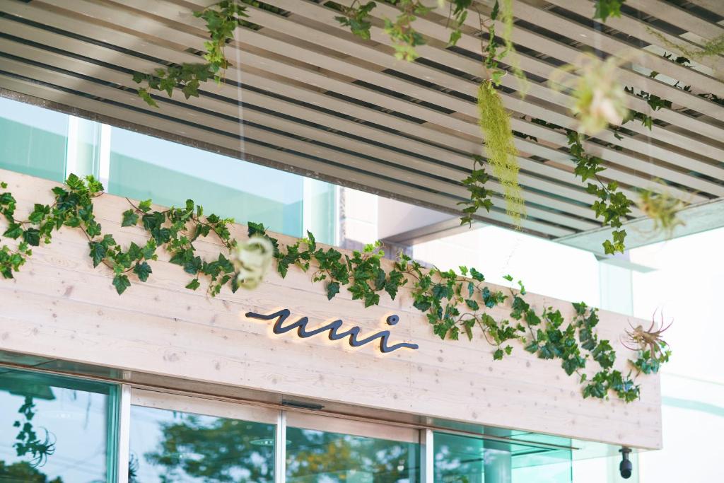 a row of plants hanging from the ceiling of a building at Hayama Umino Hotel in Hayama