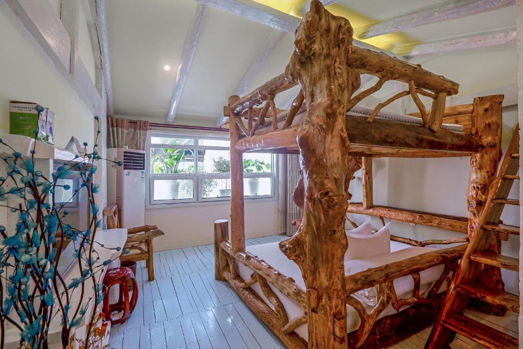 Postel nebo postele na pokoji v ubytování Zhoujia Hostel