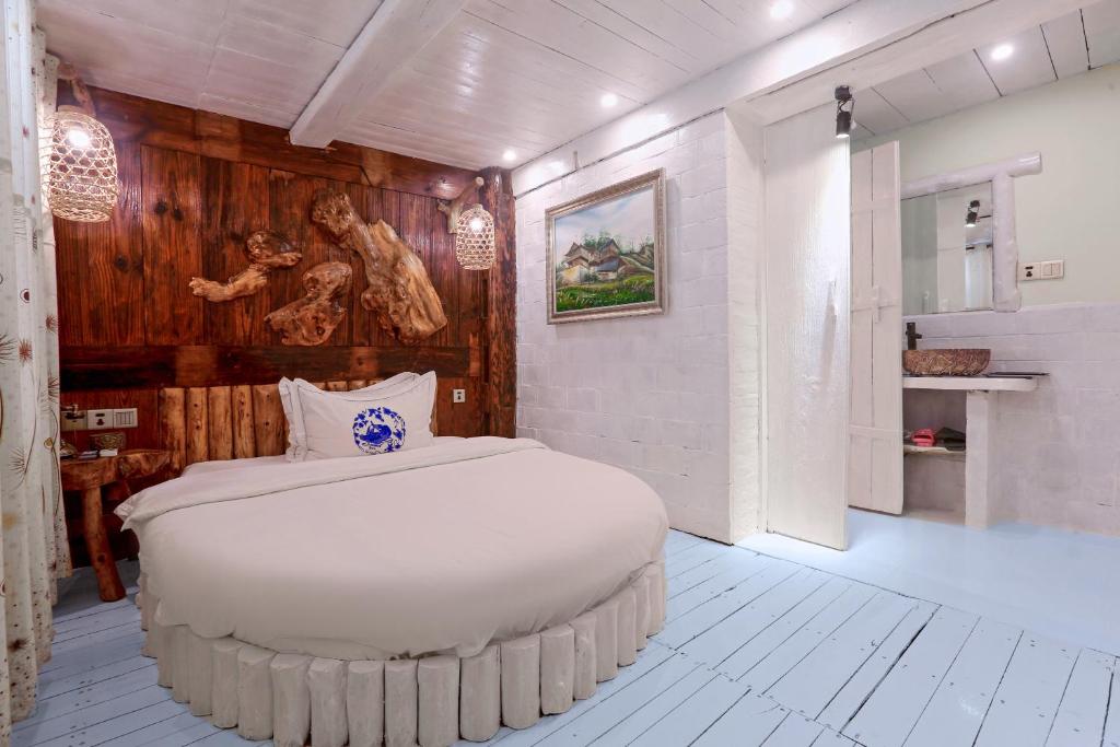 Postel nebo postele na pokoji v ubytování Zhoujia Hostel