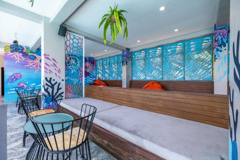 Postel nebo postele na pokoji v ubytování Kana Triple L Hotel Phuket普吉岛卡娜3L酒店