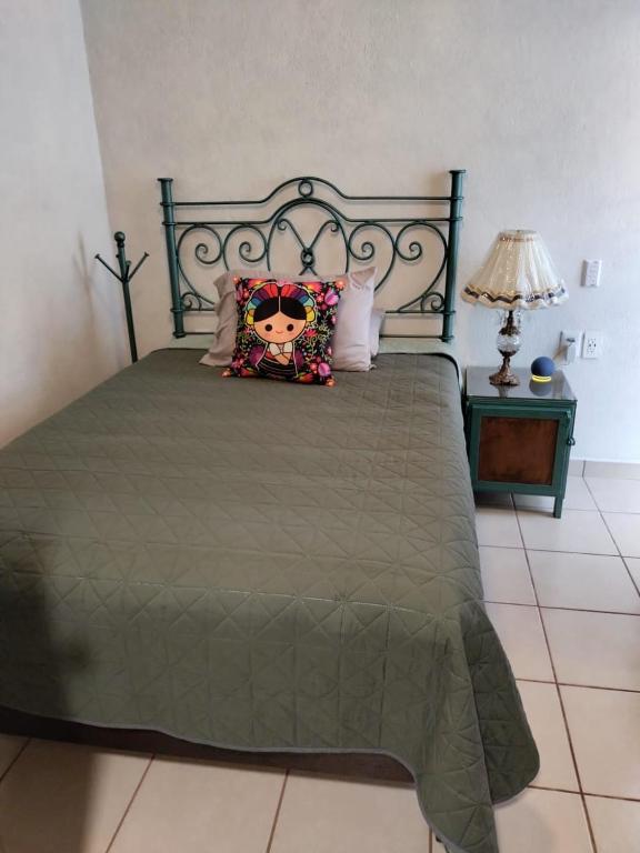 Postel nebo postele na pokoji v ubytování HOTEL CASA LIMON