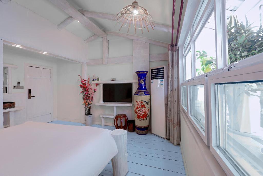 TV a/nebo společenská místnost v ubytování Zhoujia Hostel